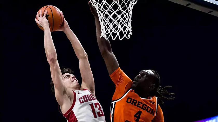 The Cougars’ Adria Rodeiguez (13) puts up a contested shot against Oregon State. The Cougars defeated the Beavers 81-67.
