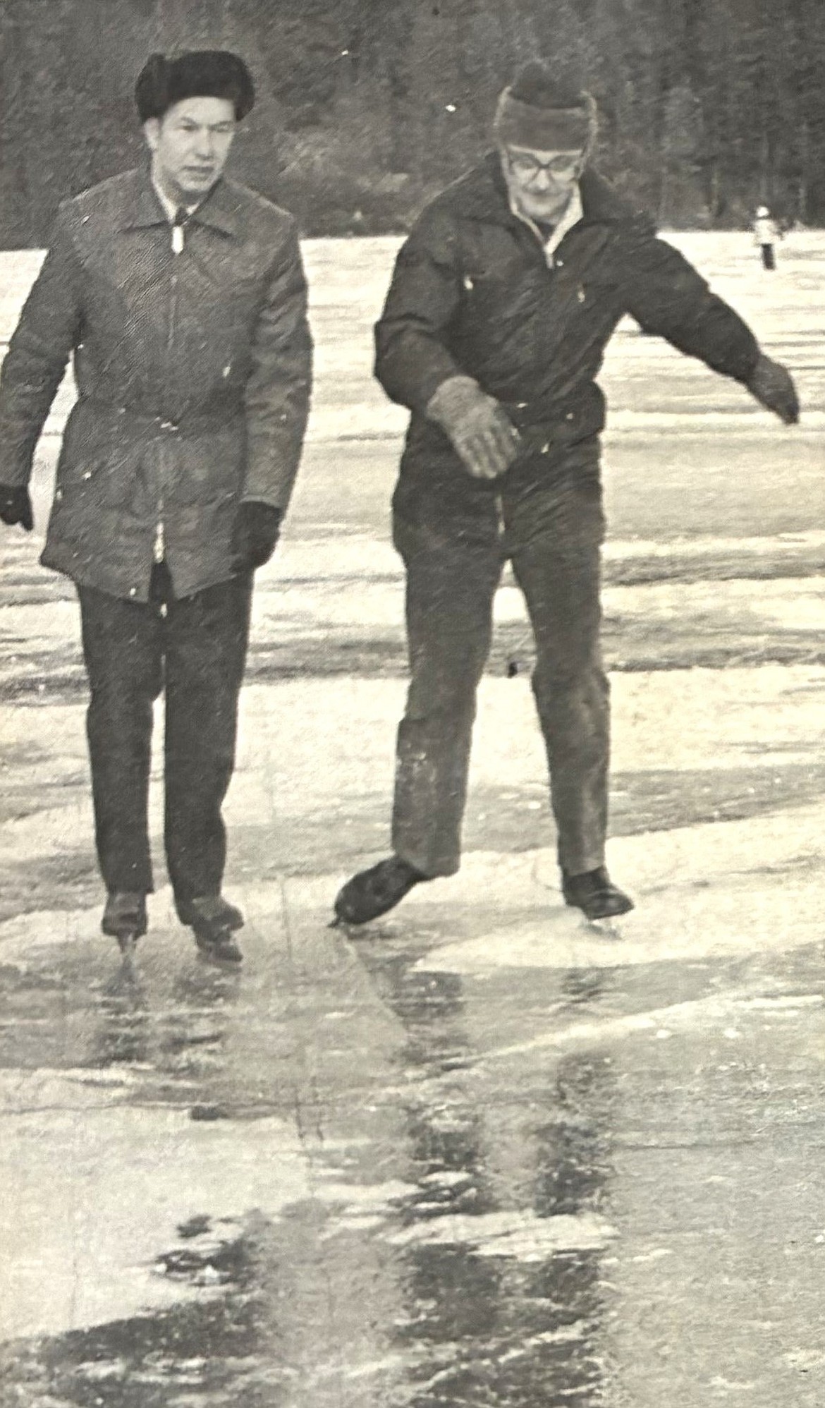 Legislator Art Manley, left, and North Idaho College President Barry Schuler discuss college funding in 1976 while skating on Fernan Lake.