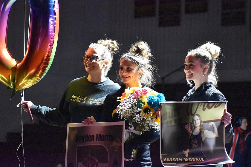 Hayden Morris from Moses Lake is joined by her family as they celebrate her 100th career wrestling win Wednesday evening. Morris said she credits her success to support from her teammates.