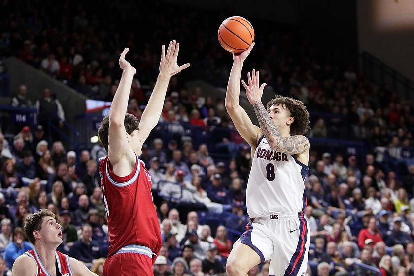 Gonzaga guard Jalen Warley (8) shoots while pressured by Loyola Marymount forward Rokas Jocius during the second half of an NCAA college basketball game, Sunday, Jan. 4, 2026, in Spokane, Wash.