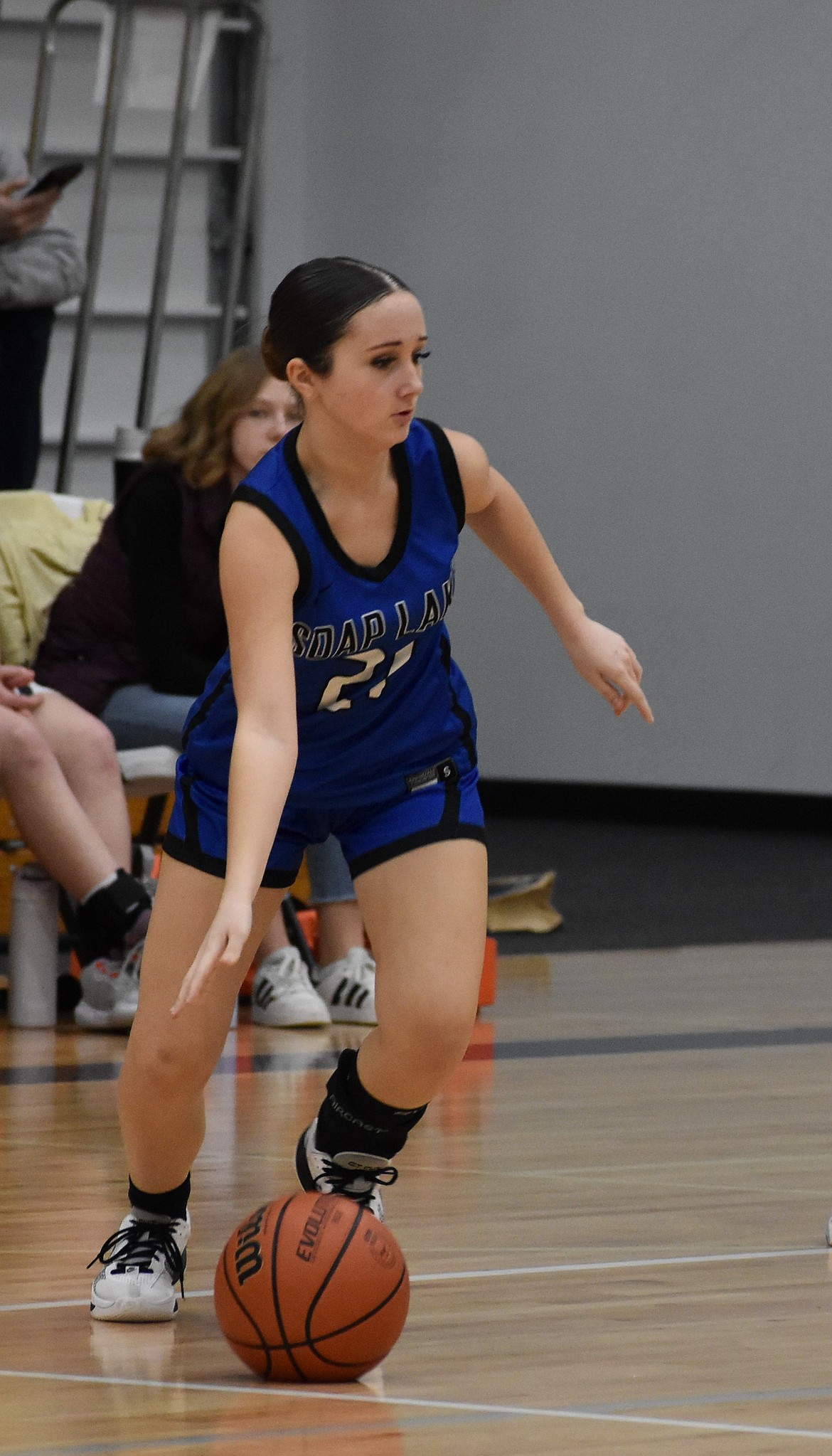 Freshman Jade Hart from Soap Lake dribbles the ball along the center of the court during Thursday’s league matchup against the Lions.