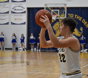 Lions senior Antonio Serrato shoots for three during Thursday’s game against Soap Lake. Serrato shot a career high of five three-pointers in the Lion’s victory.