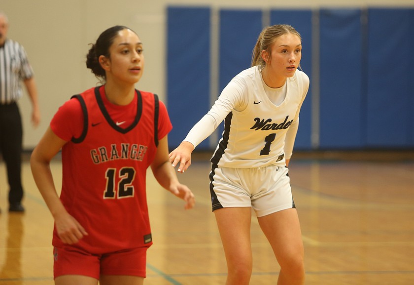 Kaleigh Secrist (1) guards a Granger player closely during their game Friday. Warden defeated Granger 41-39 after pulling off the second half comeback.