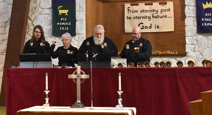 From left: Trooper Janes, Carol Roper, George Roper and Pastor Adam Janes ring handbells at Othello Christian Church’s winter concert Sunday.