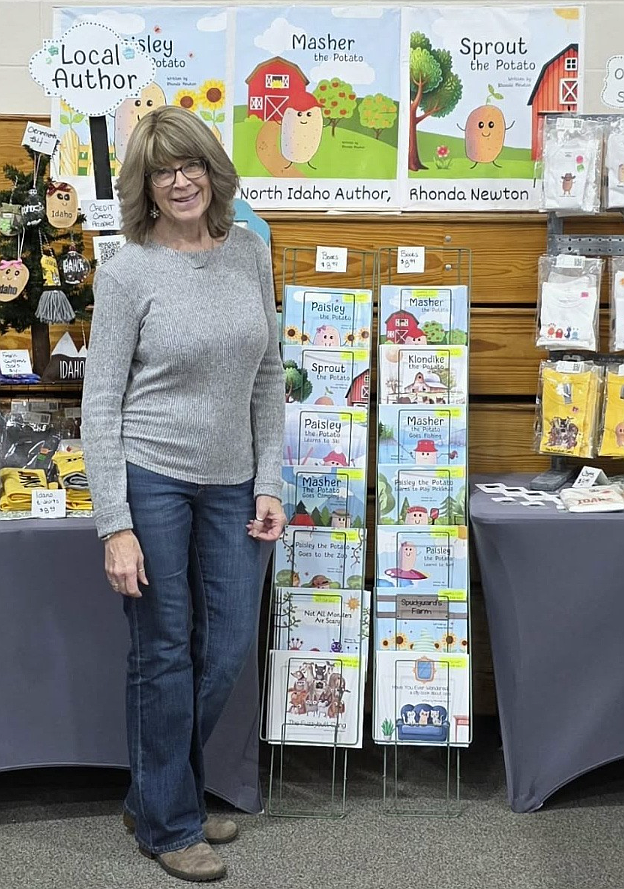 Rhonda Newton of Rathdrum is seen at a recent event with her books and famous potato characters Paisely, Masher and Sprout. The author connects with audiences and sells inventory at local markets and brick-and-mortar stores as well as through online marketplaces such as Etsy.