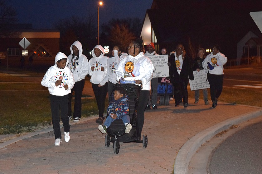 Community members and Moses Lake Martin Luther King Jr. Committee participants walk from the Surf ‘n Slide Waterpark to the Civic Center during last year’s freedom march. This year the march will be preceded by a community dinner and silent auction Saturday evening.