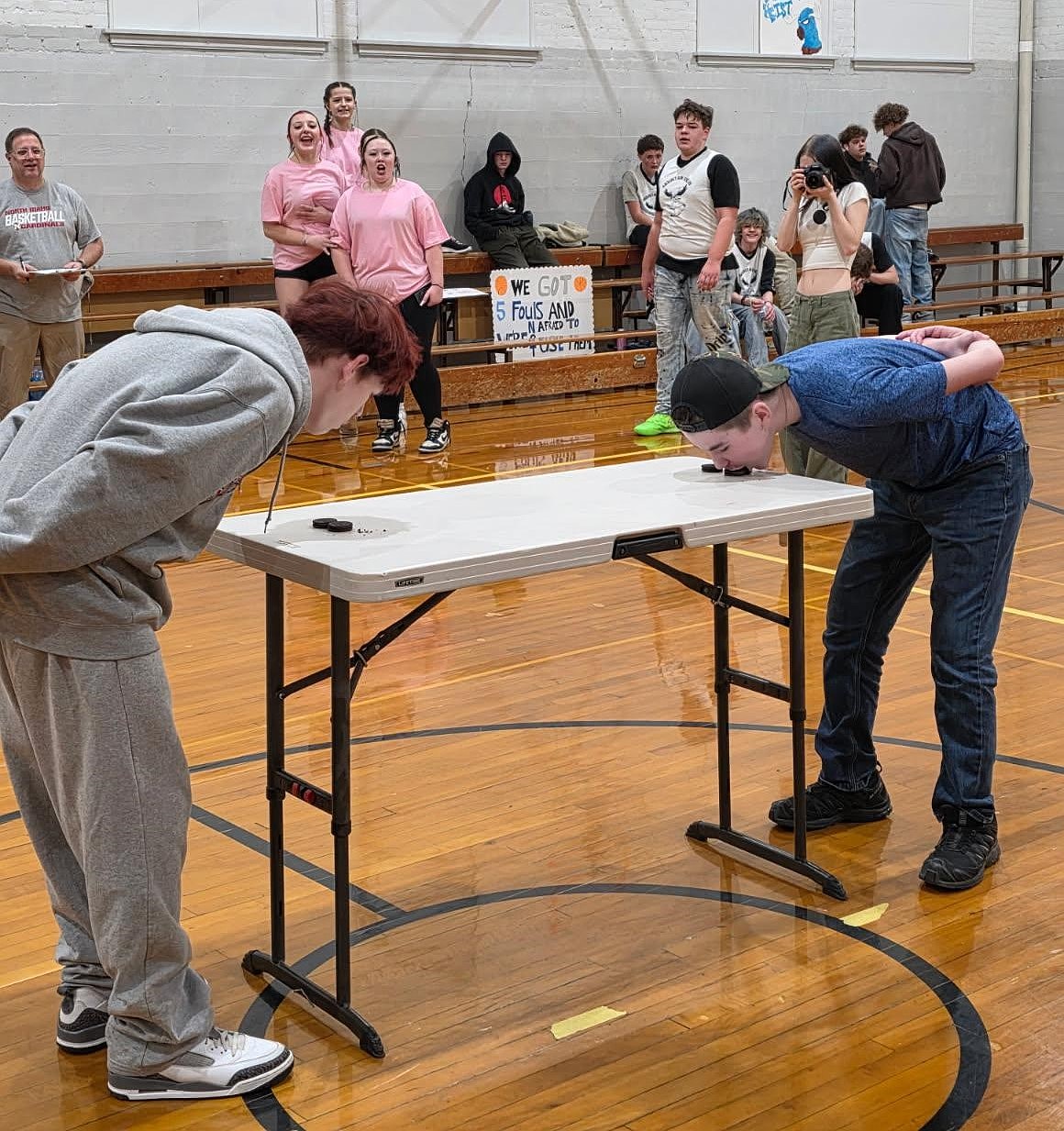 New Vision freshman Liam Leathers, left, and Mountain View sophomore Daniken Desens go Oreo to Oreo during the Hubcap Heist hands-free eating contest Wednesday.