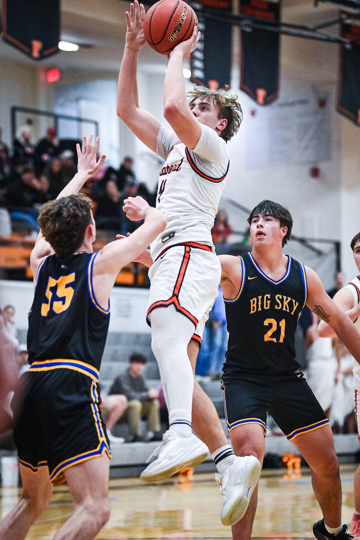 Flathead's Eli Coopman (4) shoots in the lane in the first half against Missoula Big Sky at Flathead High School on Thursday, Jan. 15. (Casey Kreider/Daily Inter Lake)