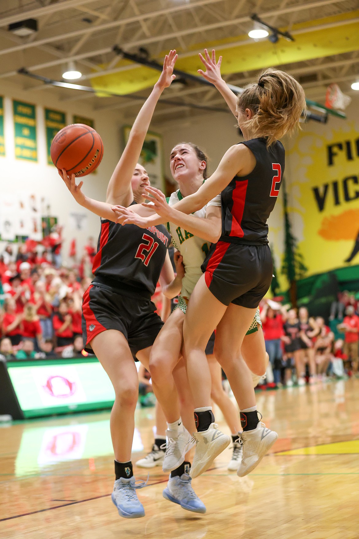JASON DUCHOW PHOTOGRAPHY
Lakeland senior Karstyn Kiefer tries to split a pair of Sandpoint defenders during the Battle for the Paddle spirit game Friday night in Rathdrum.