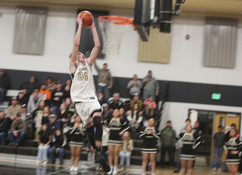 Grant Wardenaar (24) slams the ball down for two points as the Knights battled Zillah Friday. Royal fell short after Zillah drilled a buzzer beater three-pointer to win 88-84.