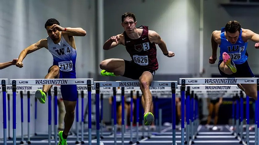 Wildcats freshman David Brown (3) competes in the 60-meter hurdles event against Huskies junior Jonathan Frazier during the UW Preview. Brown completed the 60-meter hurdles event with a time of 8.08 to take first.