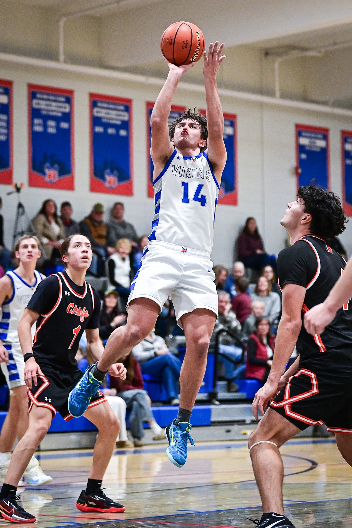 Bigfork's Treker HIckey (14) drives into the lane for a jumper in the first half against Ronan at Bigfork High School on Tuesday, Jan. 20. (Casey Kreider/Daily Inter Lake)