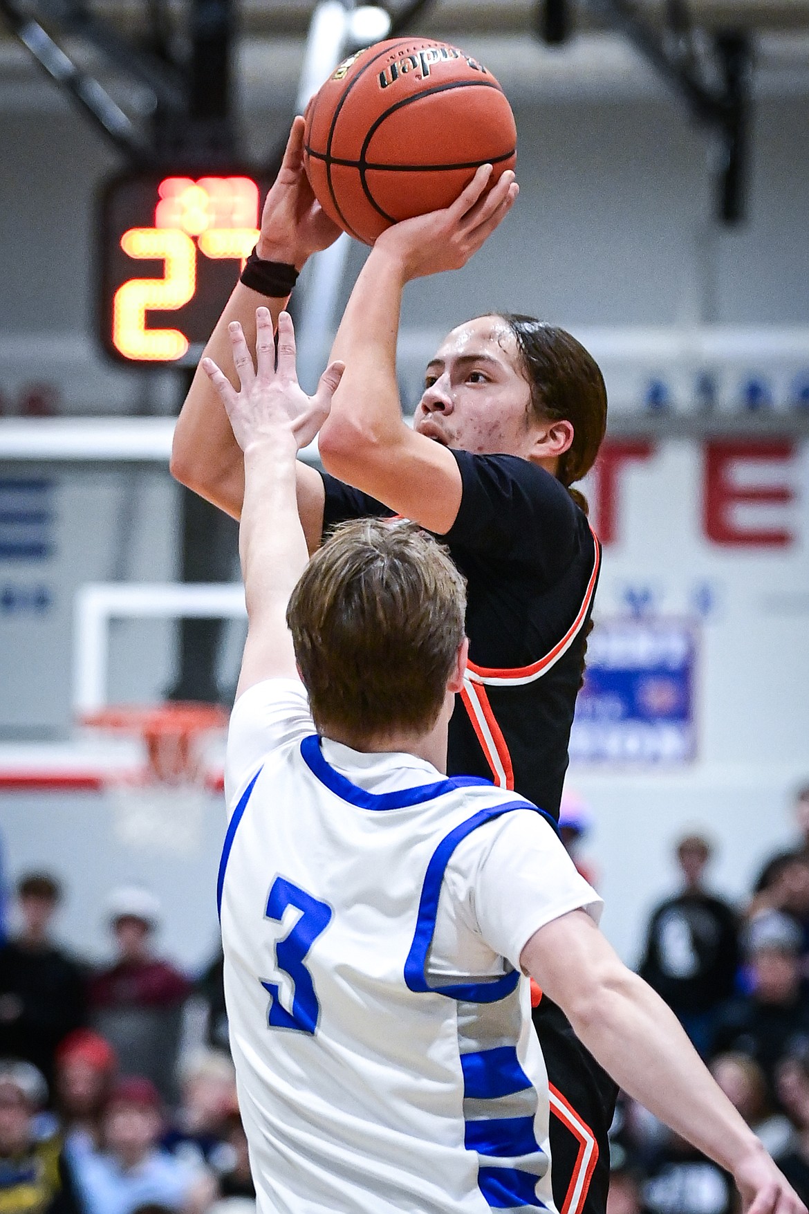 Ronan's Matiya Nenemay (1) knocks down a three guarded by Bigfork's Grady Campbell (3) in the second half against Bigfork at Bigfork High School on Tuesday, Jan. 20. (Casey Kreider/Daily Inter Lake)