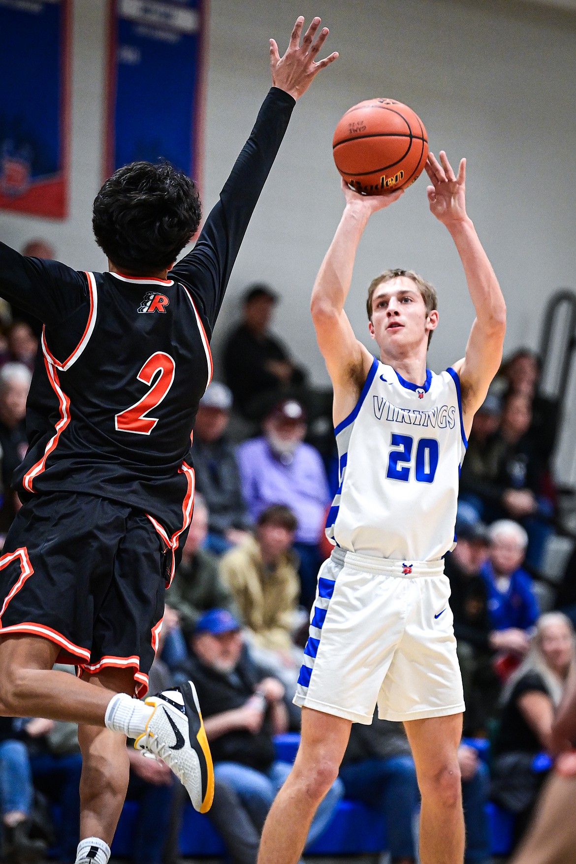Bigfork's Alex Ochs (20) knocks down a three in the first half against Ronan at Bigfork High School on Tuesday, Jan. 20. (Casey Kreider/Daily Inter Lake)