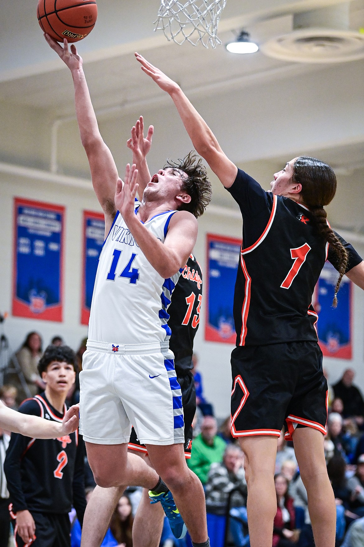 Bigfork's Treker Hickey (14) drives to the basket in the first half against Ronan at Bigfork High School on Tuesday, Jan. 20. (Casey Kreider/Daily Inter Lake)