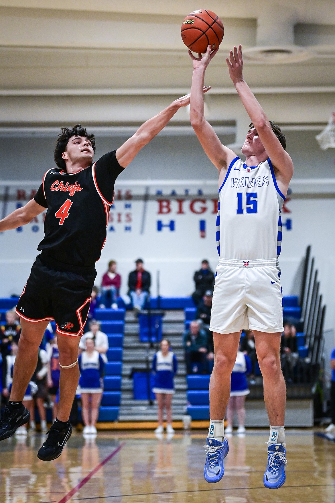 Bigfork's Austin Savik (15) shoots guarded by Ronan's Kolby Finley (4) in the first half at Bigfork High School on Tuesday, Jan. 20. (Casey Kreider/Daily Inter Lake)