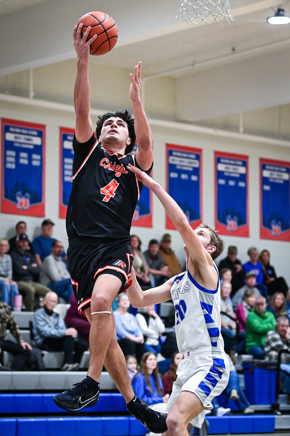 Ronan's Kolby Finley (4) drives to the basket in the second half against Bigfork at Bigfork High School on Tuesday, Jan. 20. (Casey Kreider/Daily Inter Lake)