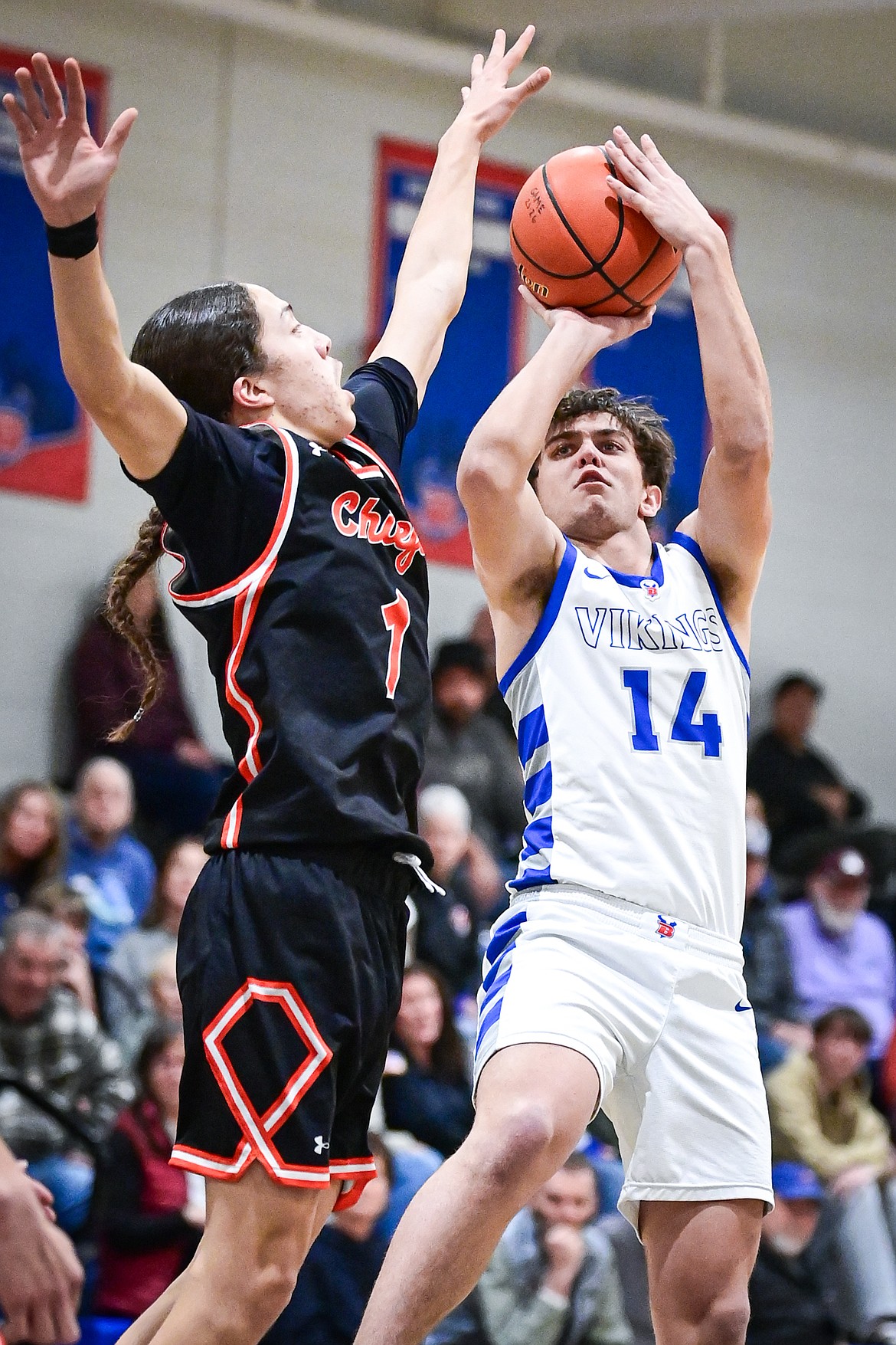 Bigfork's Treker Hickey (14) shoots guarded by Ronan's Matiya Nenemay (1) in the first half at Bigfork High School on Tuesday, Jan. 20. (Casey Kreider/Daily Inter Lake)
