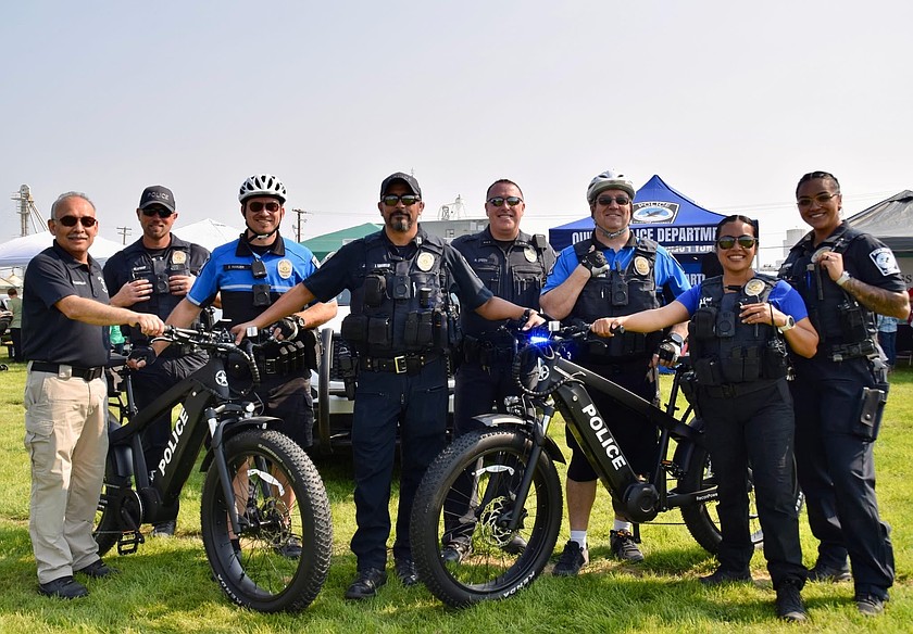 The Quincy Police Department smiles for a photo at Farmer Consumer Awareness Day.