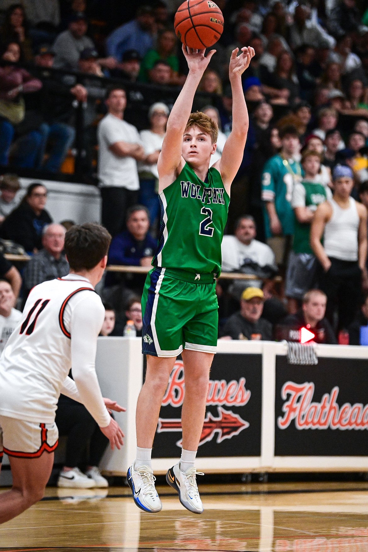 Glacier's Ethan Kastelitz (2) shoots a three in the first half against Flathead at Flathead High School on Friday, Jan. 23. (Casey Kreider/Daily Inter Lake)
