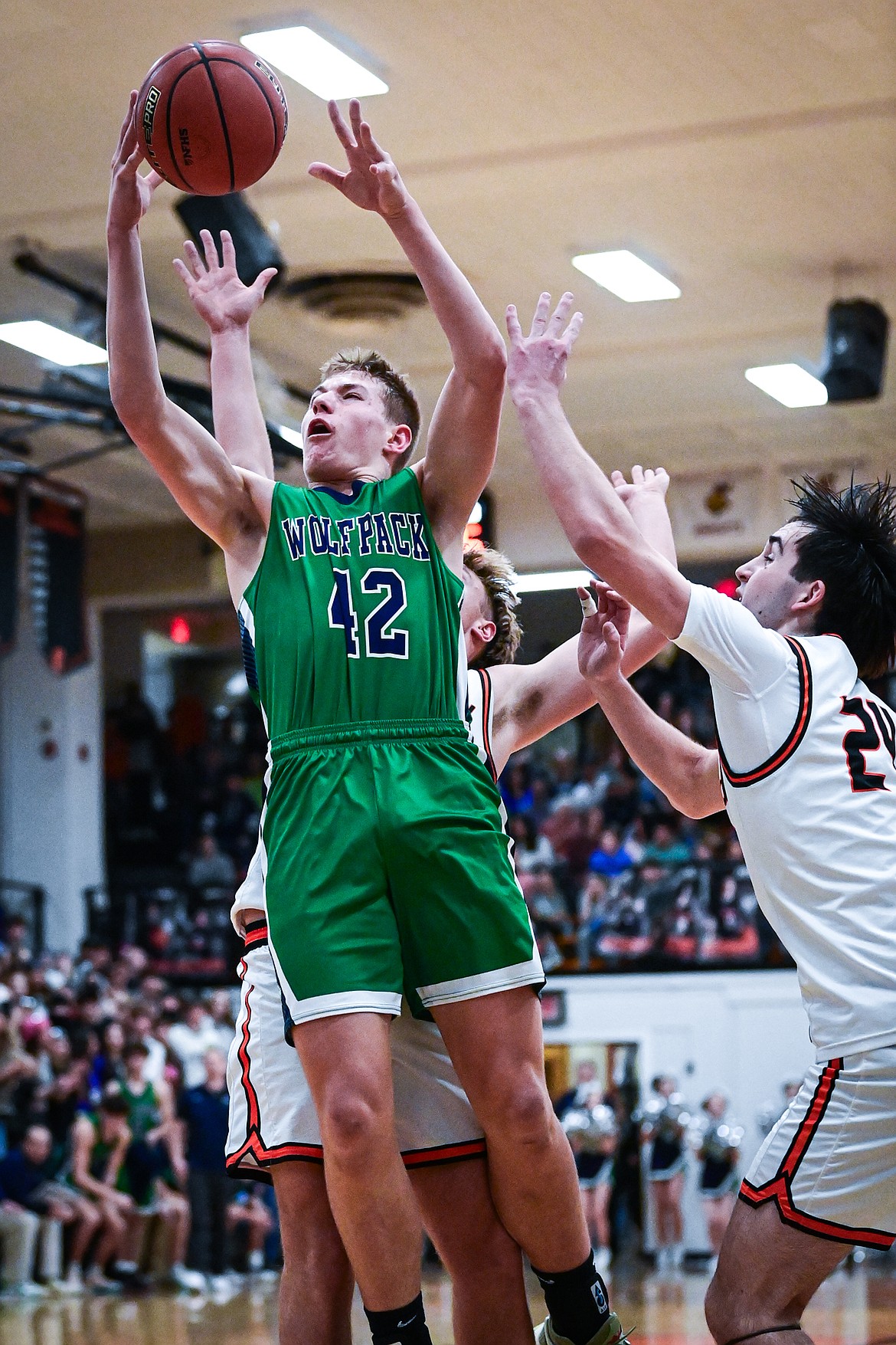 Glacier's Carter Knopik (42) drives to the basket in the first half against Flathead at Flathead High School on Friday, Jan. 23. (Casey Kreider/Daily Inter Lake)