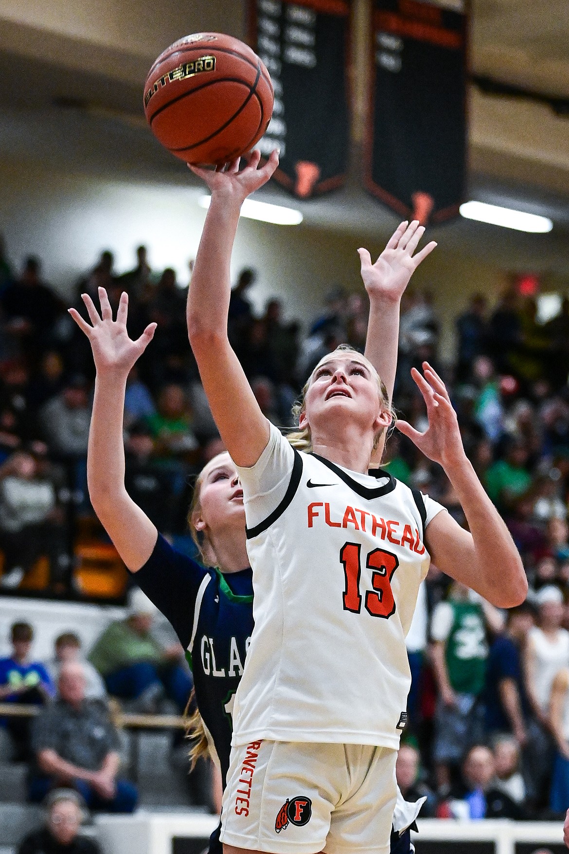 Flathead's Caitlin Converse (13) knocks down a shot in the lane in the second half against Glacier at Flathead High School on Friday, Jan. 23. (Casey Kreider/Daily Inter Lake)