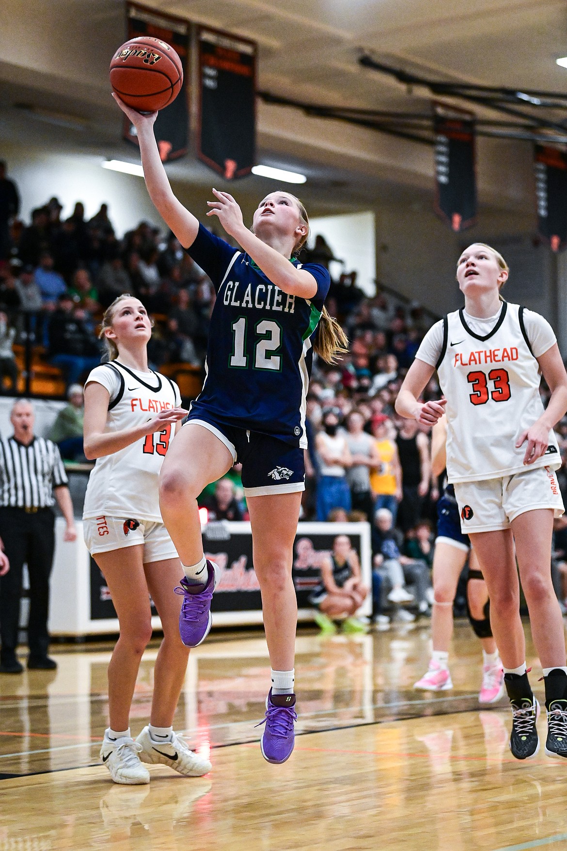 Glacier's Lucy Holloway (12) drives to the basket  in the first half against Flathead at Flathead High School on Friday, Jan. 23. (Casey Kreider/Daily Inter Lake)
