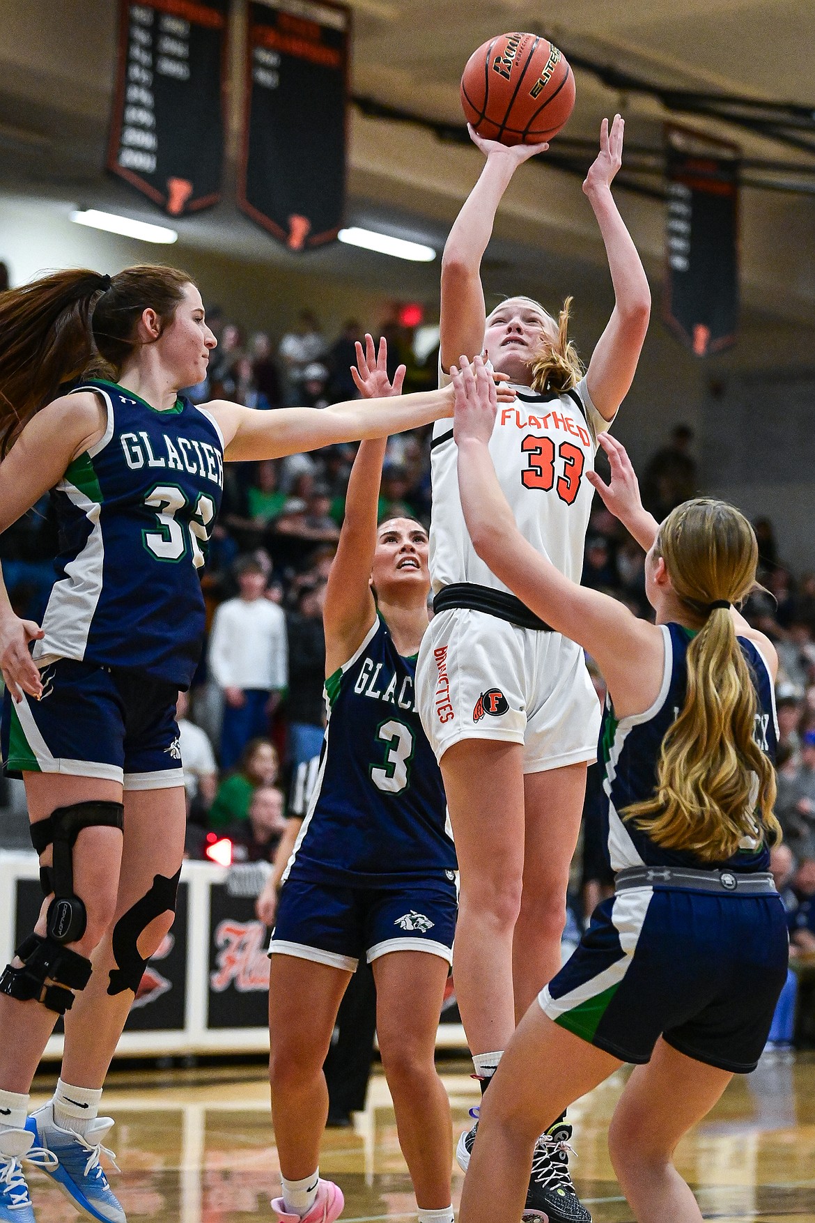 Flathead's Lexi Herion (33) knocks down a jumper in the lane in the second half against Glacier at Flathead High School on Friday, Jan. 23. (Casey Kreider/Daily Inter Lake)