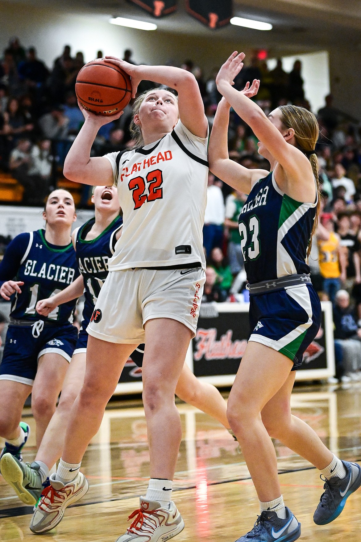 Flathead's Brynn Kossman (22) drives to the basket in the second half against Glacier at Flathead High School on Friday, Jan. 23. (Casey Kreider/Daily Inter Lake)