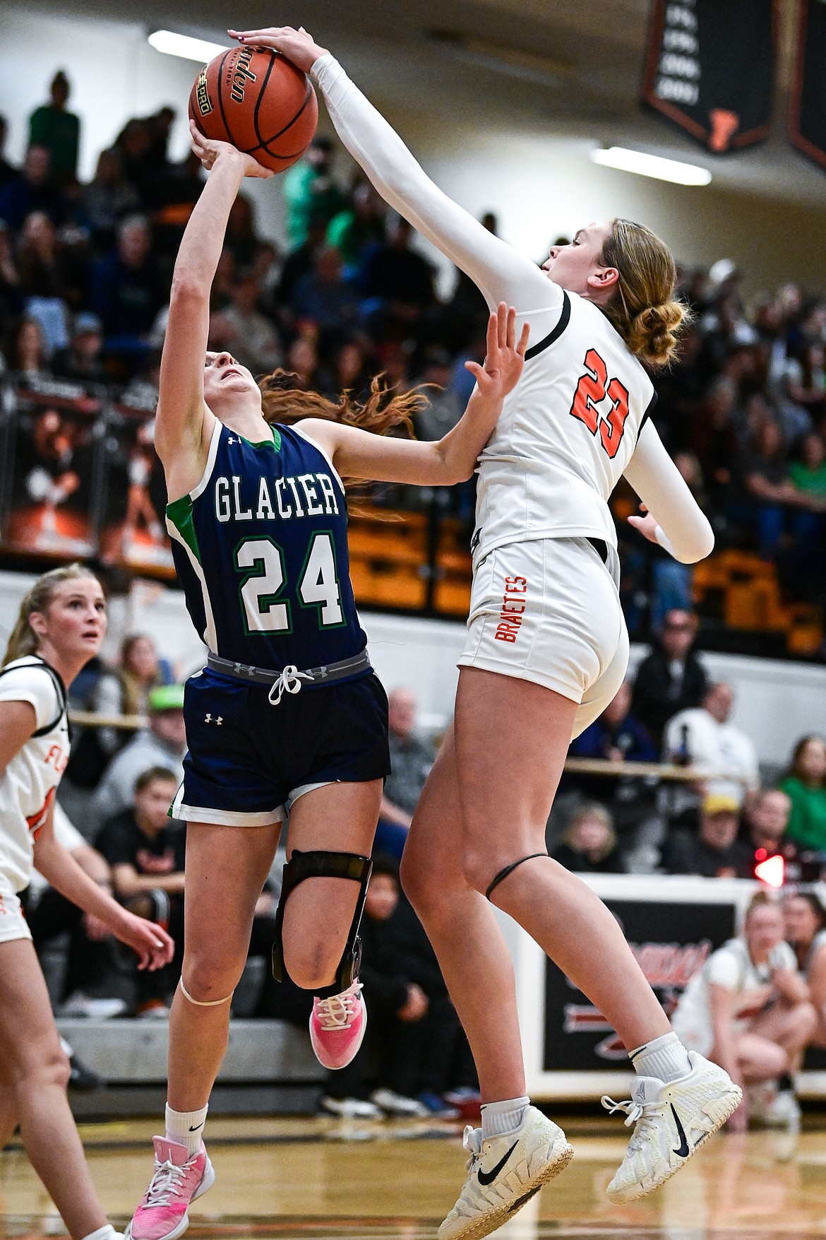 Flathead's Grace Gall (23) blocks a shot by Glacier's Cassidy Daniels (24) in the first half at Flathead High School on Friday, Jan. 23. (Casey Kreider/Daily Inter Lake)