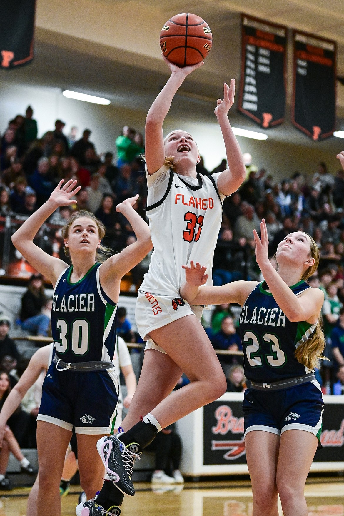 Flathead's Lexi Herion (33) drives to the basket in the second half against Glacier at Flathead High School on Friday, Jan. 23. (Casey Kreider/Daily Inter Lake)