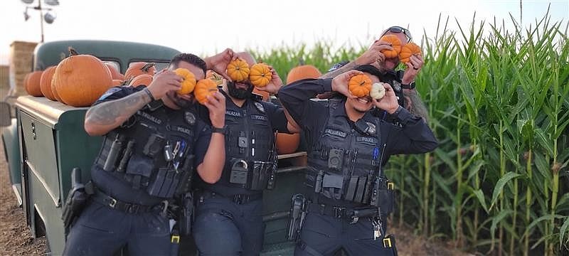 While off-duty Moses Lake Police Department officers enjoyed Palmer's Pumpkin Patch.