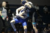 PREP WRESTLING: Hand it to Peterson — Coeur d'Alene senior, despite broken hand, starts Vikings toward win over Lake City in TerHark Cup