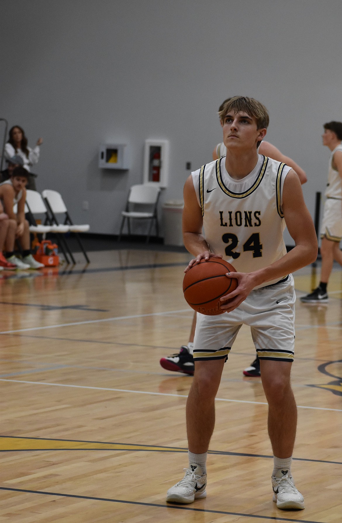 Lions senior Johnny Ferguson prepares to shoot a free throw during a previous home game this season. Johnny hit a personal milestone earlier this season as he hit 1,000 career points.