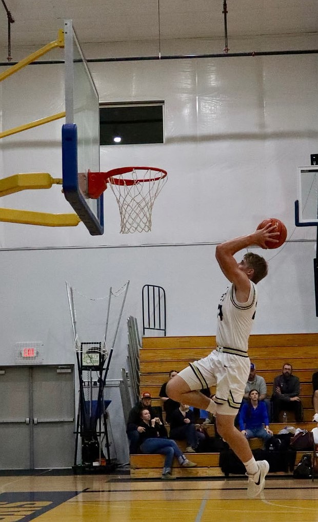 Johnny Ferguson, a MLCA/CCS senior goes in to dunk the ball during a rivalry matchup against Wilson Creek earlier in the season. Ferguson has been an offensive force on the court as he has made multiple dunks and threes throughout the season.
