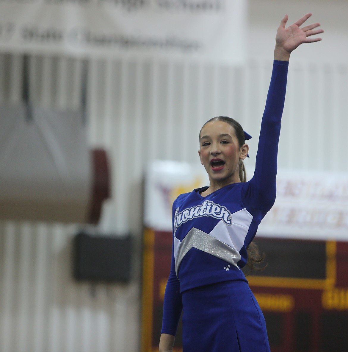Xailia Gomez from the Spartans waves to the crowd during Saturday’s competition at Moses Lake High School for the Battle at the Lake.