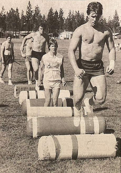 From right, Joe Tofflemire leads Post Falls High teammates Eric Tibesar and Rollin Putzier through 1983 preseason drills.