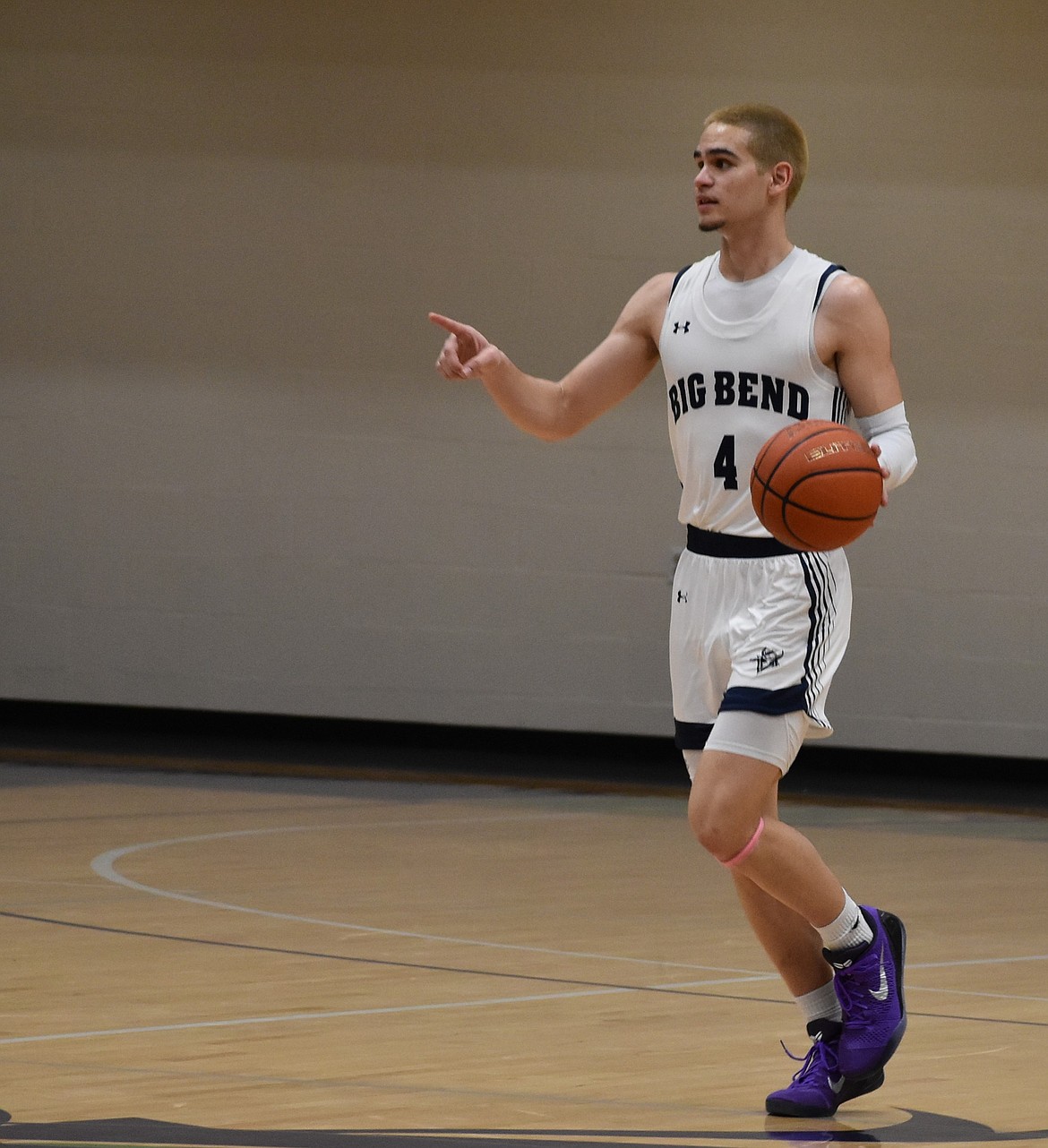 Vikings freshman Sugar Eaton motions to a teammate as he moves down the home court on Wednesday. Eaton led the team on offense with 26 points scored.