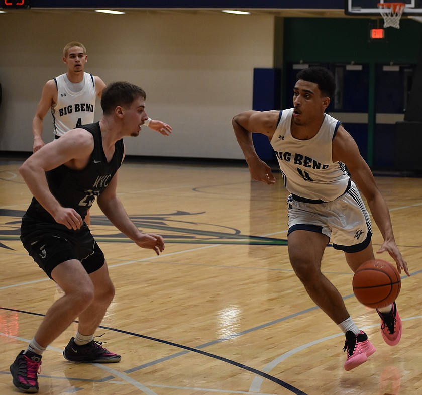 Freshman Jakari Singleton from the Vikings works to get past Nathan Stephenson from Wenatchee Valley Wednesday evening.
