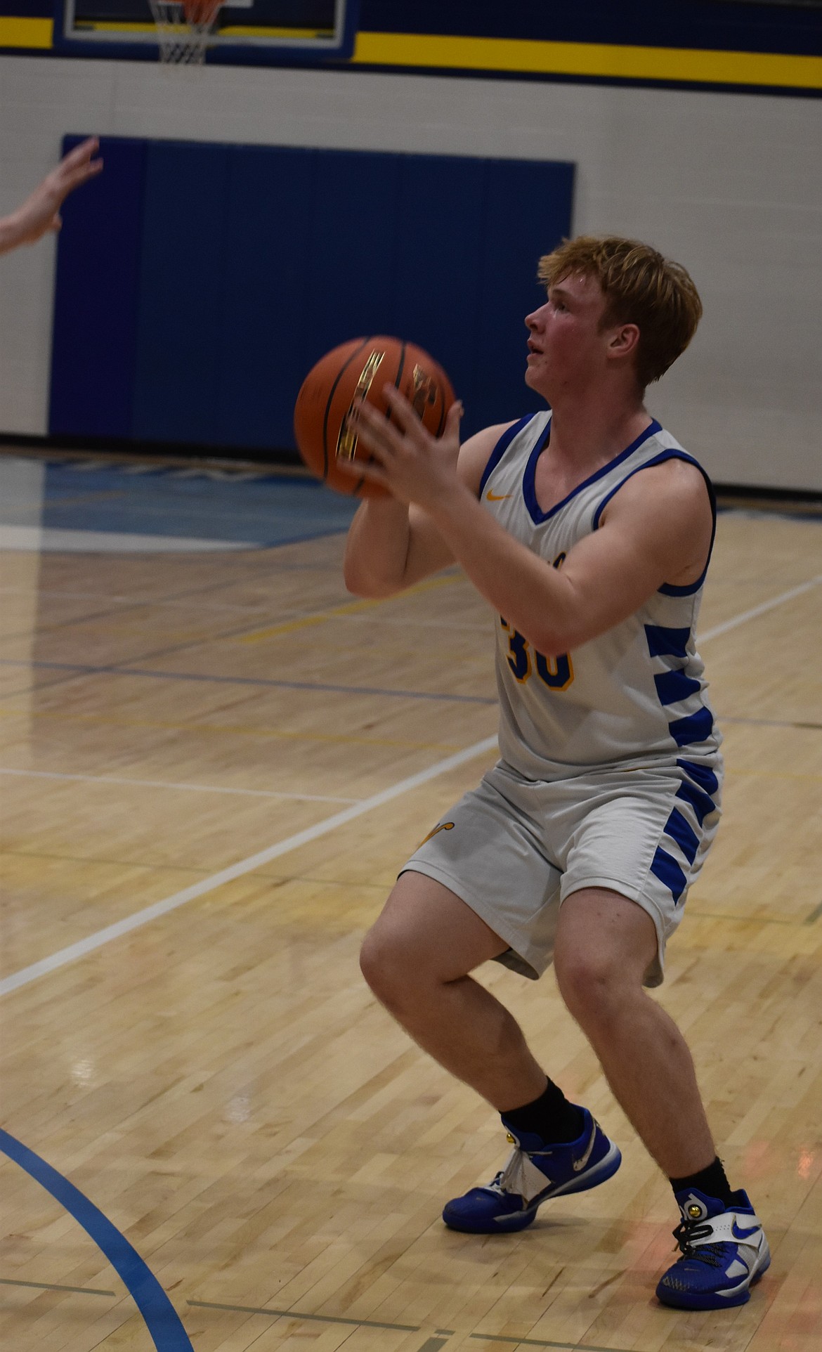 Aiden Valline, a Wilson Creek senior, looks to shoot for three against the Lions during Thursday’s home game.