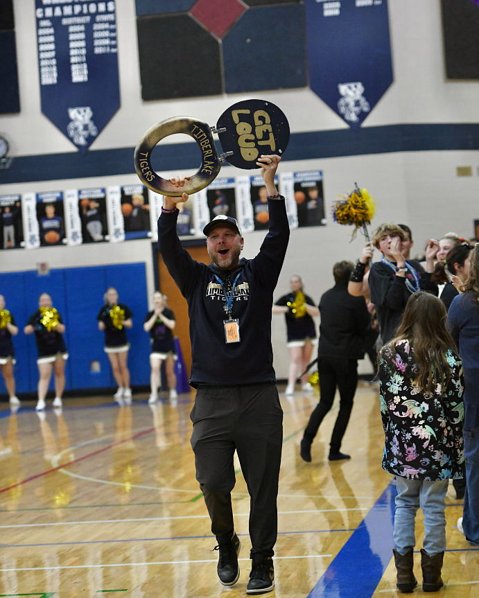 Timberlake Principal Ryne Eberlin leads the crowd in cheering for the Tigers during the Backwoods Brawl basketball games and spirit contest Jan. 17 at Bonners Ferry High. This was the ninth consecutive year Timberlake won the spirit competition against a rival school.