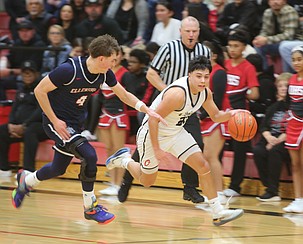 Kingston Valdez (22) drives past an Ellensburg defender. Othello defeated the Bulldogs 71-68 at home Tuesday.