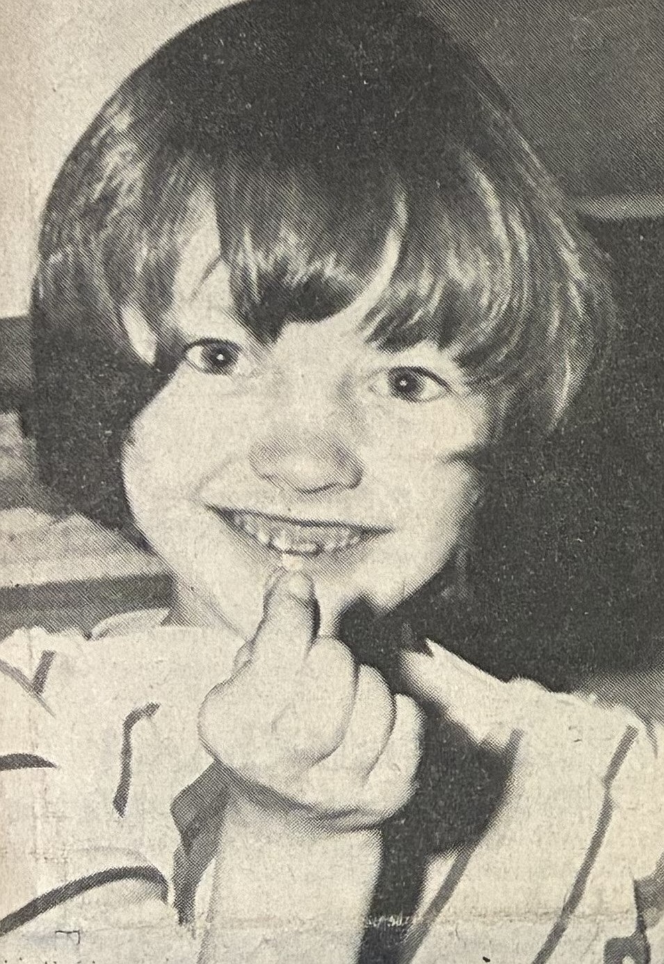 Shauna Barrus, 8, shows her extracted tooth in 1966.