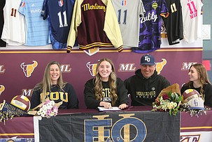 Kardyn Martinez, second from left, signs her letter of intent to play soccer at Eastern Oregon University.