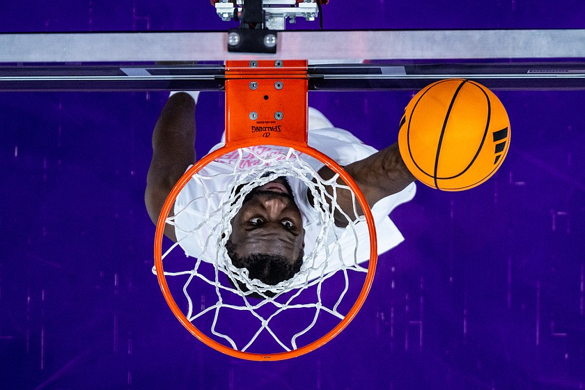Washington Huskies center Franck Kepnang dunks during warmups before an NCAA college basketball game against the Iowa Hawkeyes, Wednesday, Feb. 4, 2026, in Seattle.