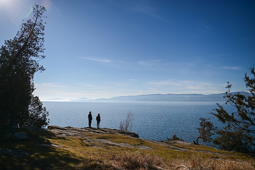 People go for a walk at the Wayfarers Unit of Flathead Lake State Park in Bigfork on Thursday, Feb. 5. (Casey Kreider/Daily Inter Lake)