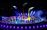 Olympians march in Milan and the mountains at a multi-site opening ceremony for the Winter Games