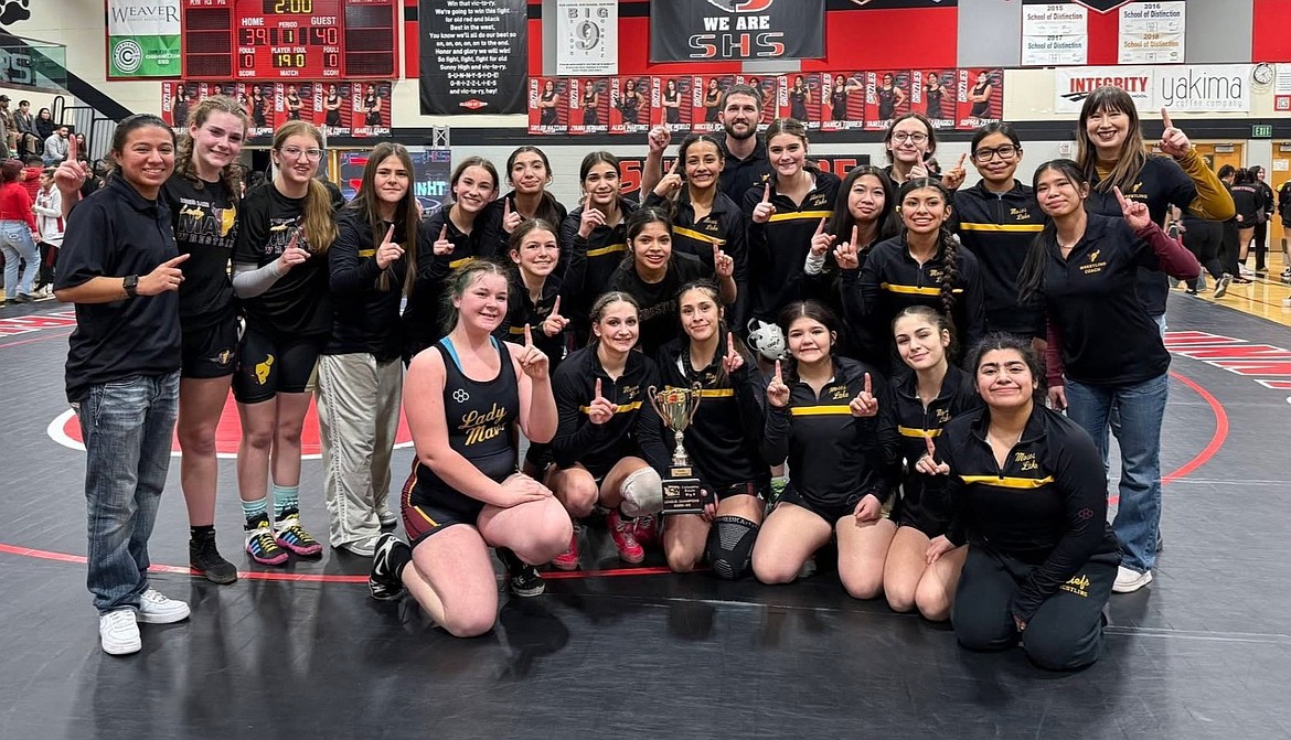 The Mavericks take a team photo after securing championship status in the Big 9 by defeating Sunnyside 40-39.