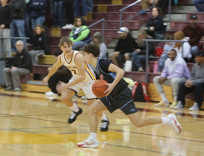 The Mavs’ Brady Jay (2) guards his opponent from Eastmont in transition Friday. The Mavericks defeated the Wildcats 79-76 Friday.