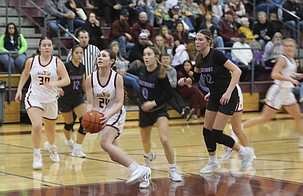 Ella Wiltbank (24) drives to the basket for a layup against Eastmont. The Mavericks suffered a 54-34 loss Friday to the Wildcats at home.